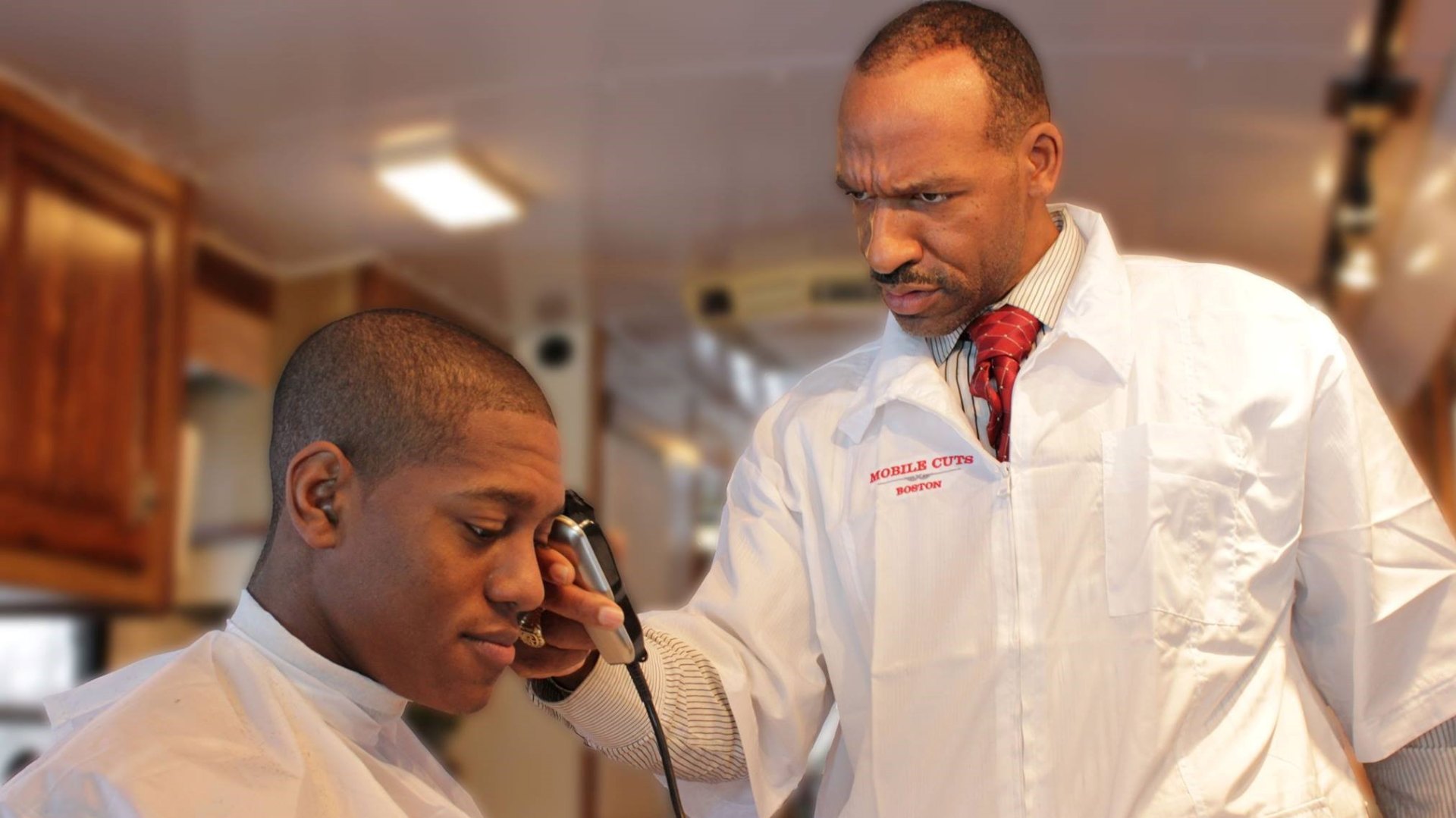 Christopher, Mobile Cuts master barber, mid-service